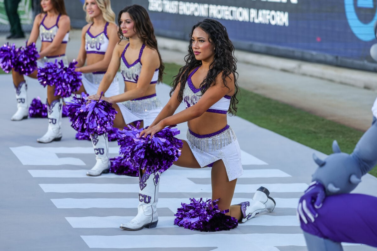 Sep 26, 2026; Orlando, Florida, USA; TCU Horned Frogs cheer team kneel for an injury on the field during the second half against the UCF Knights at Acrisure Bounce House. Mandatory Credit: Mike Watters-Imagn Images