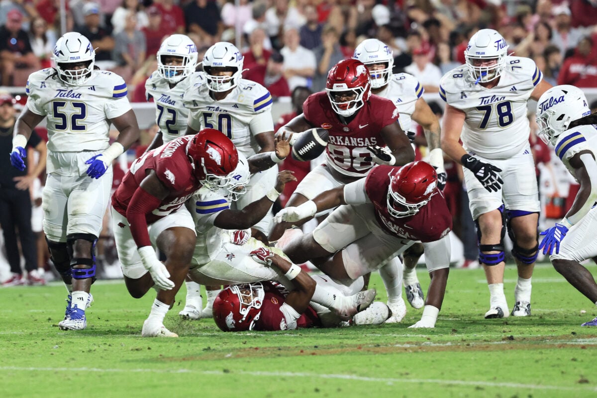 Sep 26, 2026; Fayetteville, Arkansas, USA;  Tulsa Golden Hurricanes quarterback Dexter Williams II (5) fumbles the ball during the fourth quarter against the Arkansas Razorbacks at Donald W. Reynolds Razorback Stadium.  Mandatory Credit: Nelson Chenault-Imagn Images
