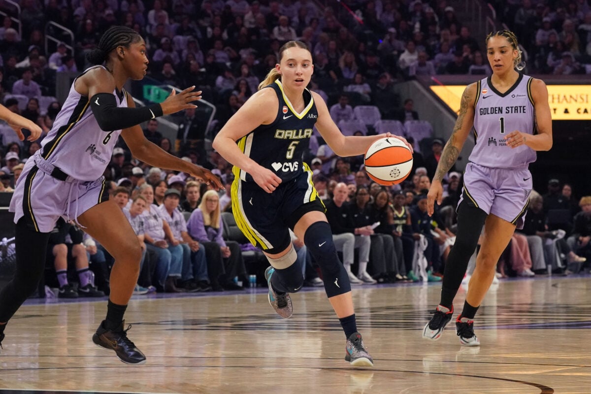 Sep 27, 2026; San Francisco, California, USA;  Dallas Wings guard Paige Bueckers (5) dribbles by Golden State Valkyries guard-forward Kaila Charles (6) and forward Gabby Williams (1) in the second quarter during game one of the first round for the 2026 WNBA Playoffs at Chase Center.  Mandatory Credit: David Gonzales-Imagn Images