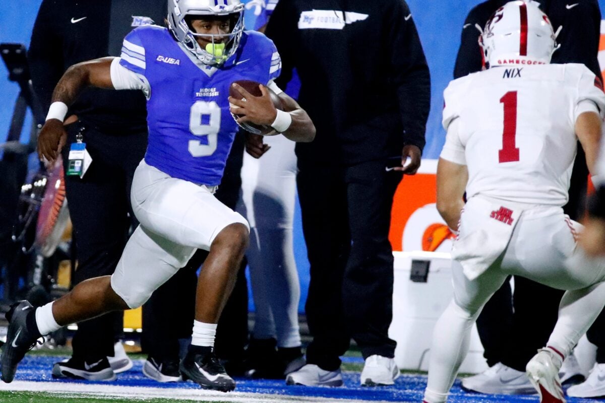 Middle Tennessee running back Jekail Middlebrook (9) carries the ball as Jacksonville State Gamecocks safety Caleb Nix (1) moves in for a tackle during the football game between Middle Tennessee and Jacksonville State, at MTSU on Wednesday, October 29, 2025.