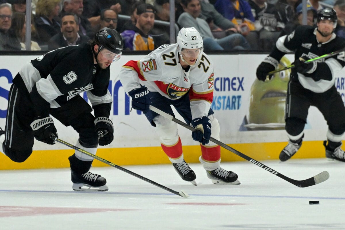 Nov 6, 2025; Los Angeles, California, USA; Los Angeles Kings right wing Adrian Kempe (9) and Florida Panthers center Eetu Luostarinen (27) chase down the puck at Crypto.com Arena. Mandatory Credit: Jayne Kamin-Oncea-Imagn Images