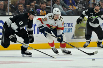 Nov 6, 2025; Los Angeles, California, USA;  Los Angeles Kings right wing Adrian Kempe (9) and Florida Panthers center Eetu Luostarinen (27) chase down the puck at Crypto.com Arena. Mandatory Credit: Jayne Kamin-Oncea-Imagn Images