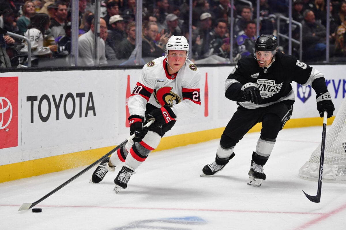 Nov 24, 2025; Los Angeles, California, USA; dOttawa Senators left wing Fabian Zetterlund (20) moves the puck ahead of Los Angeles Kings defenseman Cody Ceci (5) during the third period at Crypto.com Arena. Mandatory Credit: Gary A. Vasquez-Imagn Images