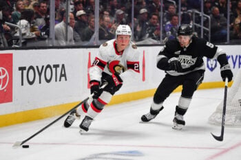 Nov 24, 2025; Los Angeles, California, USA; dOttawa Senators left wing Fabian Zetterlund (20) moves the puck ahead of Los Angeles Kings defenseman Cody Ceci (5) during the third period at Crypto.com Arena. Mandatory Credit: Gary A. Vasquez-Imagn Images