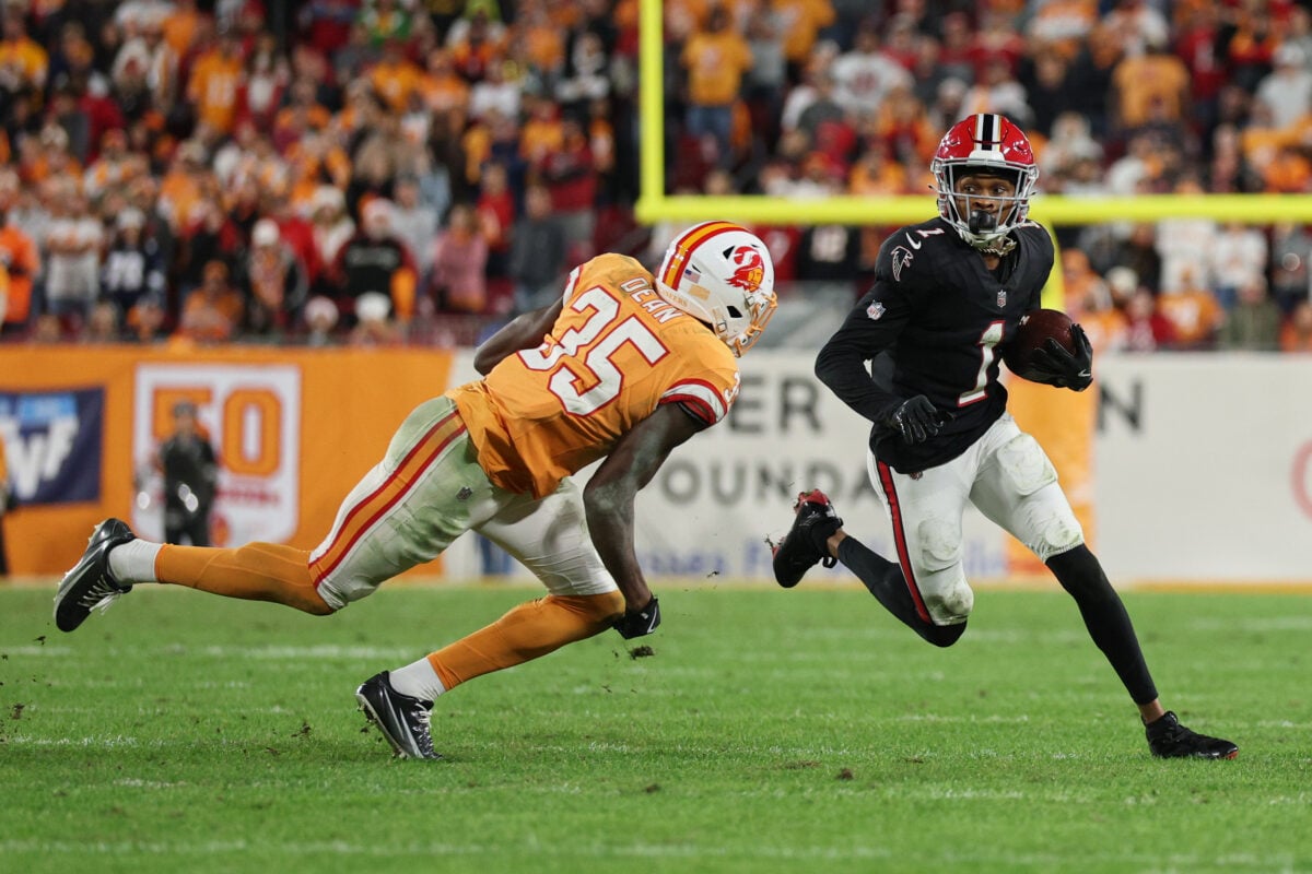 Dec 11, 2025; Tampa, Florida, USA; Atlanta Falcons wide receiver Darnell Mooney (1) runs after the catch against Tampa Bay Buccaneers cornerback Jamel Dean (35) during the fourth quarter at Raymond James Stadium. Mandatory Credit: Nathan Ray Seebeck-Imagn Images