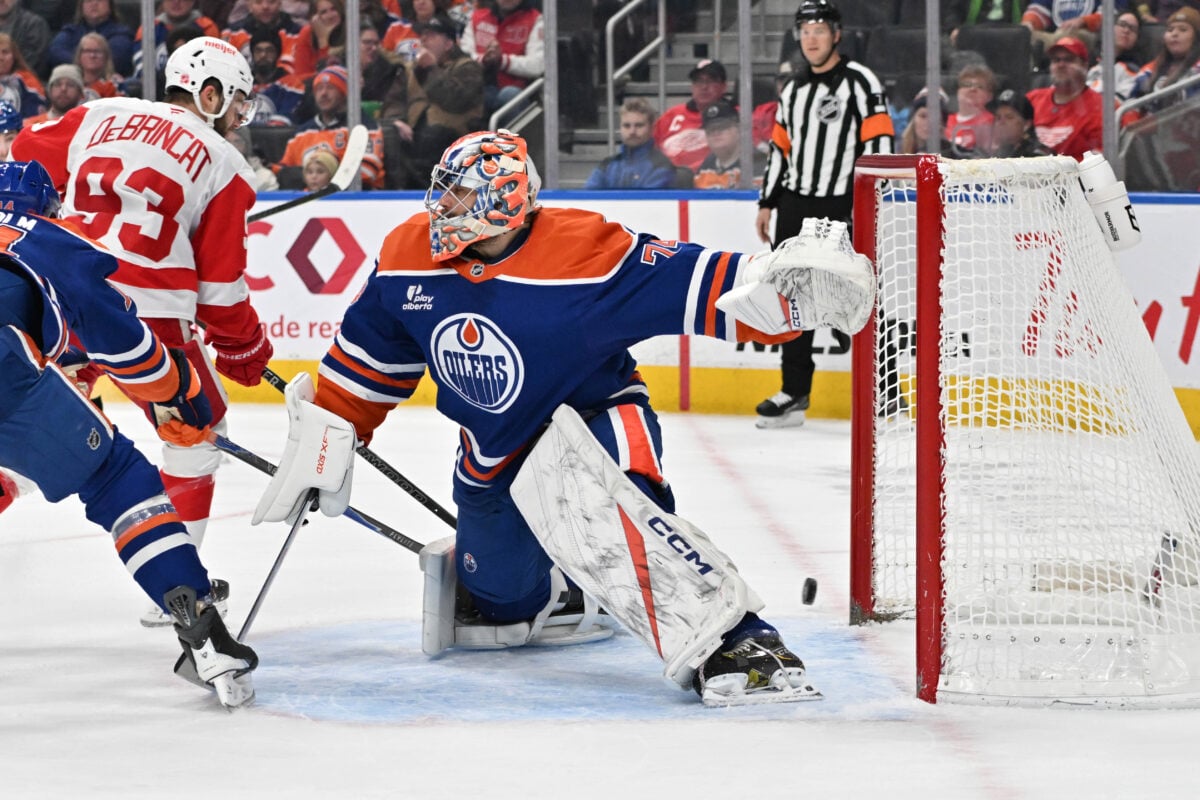 Dec 11, 2025; Edmonton, Alberta, CAN; Edmonton Oilers goalie Stuart Skinner (74) and Detroit Red Wings right winger Alex DeBrincat (93) are seen out on the ice during the second period at Rogers Place. Mandatory Credit: Walter Tychnowicz-Imagn Images