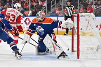 Dec 11, 2025; Edmonton, Alberta, CAN; Edmonton Oilers goalie Stuart Skinner (74) and Detroit Red Wings right winger Alex DeBrincat (93) are seen out on the ice during the second period at Rogers Place. Mandatory Credit: Walter Tychnowicz-Imagn Images