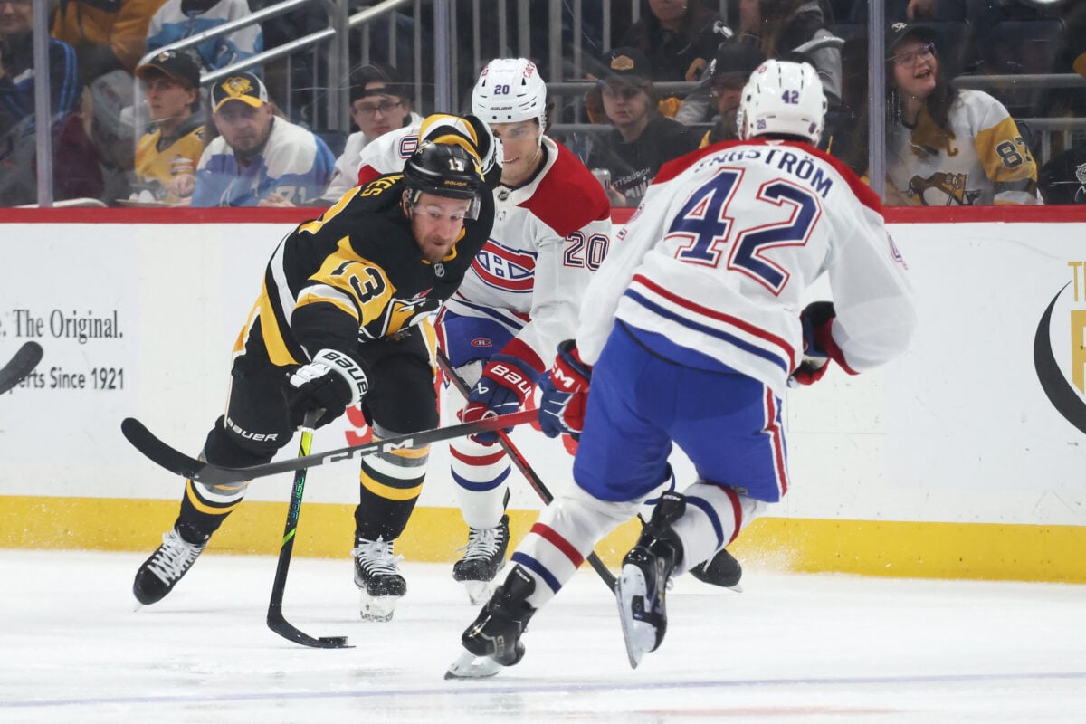 Dec 21, 2025; Pittsburgh, Pennsylvania, USA; Pittsburgh Penguins right wing Kevin Hayes (13) moves the puck against MontrŽal Canadiens left wing Juraj Slafkovsk? (20) and defenseman Adam Engstrom (42) during the first period at PPG Paints Arena. Mandatory Credit: Charles LeClaire-Imagn Images