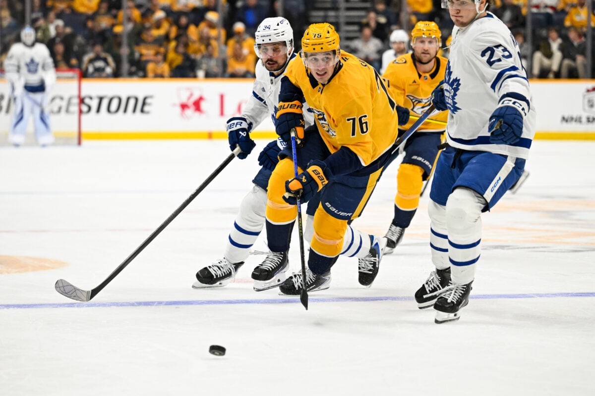 Dec 20, 2025; Nashville, Tennessee, USA; Nashville Predators defenseman Brady Skjei (76) skates past Toronto Maple Leafs left wing Matthew Knies (23) during the second period at Bridgestone Arena. Mandatory Credit: Steve Roberts-Imagn Images