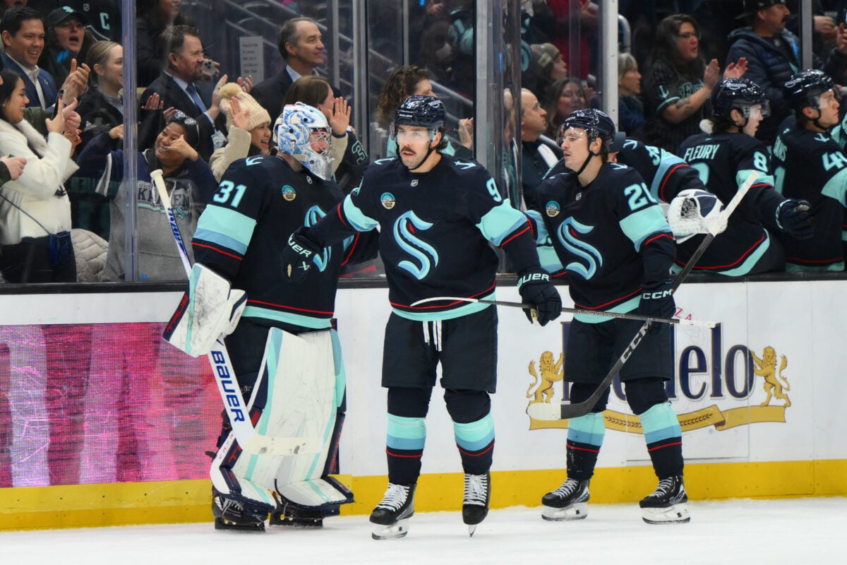 Dec 28, 2025; Seattle, Washington, USA; Seattle Kraken center Chandler Stephenson (9) celebrates with goaltender Philipp Grubauer (31) after scoring a goal against the Philadelphia Flyers during the third period at Climate Pledge Arena. Mandatory Credit: Steven Bisig-Imagn Images