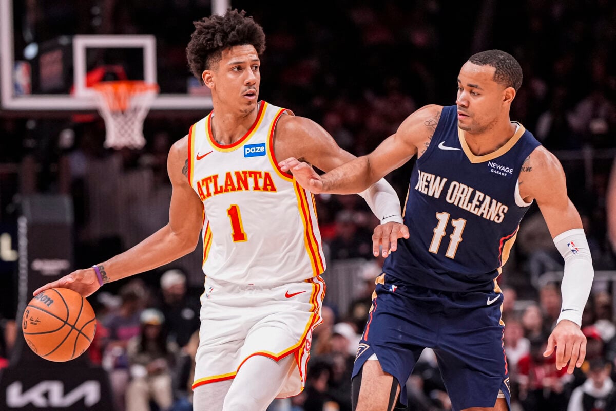Jan 7, 2026; Atlanta, Georgia, USA; Atlanta Hawks forward Jalen Johnson (1) dribbles defended by New Orleans Pelicans guard Bryce McGowens (11) during the second half at State Farm Arena. Mandatory Credit: Dale Zanine-Imagn Images