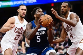 Jan 10, 2026; Cleveland, Ohio, USA; Minnesota Timberwolves guard Anthony Edwards (5) drives to the basket between Cleveland Cavaliers guard Jaylon Tyson (20) and center Evan Mobley (4) during the second half at Rocket Arena. Mandatory Credit: Ken Blaze-Imagn Images