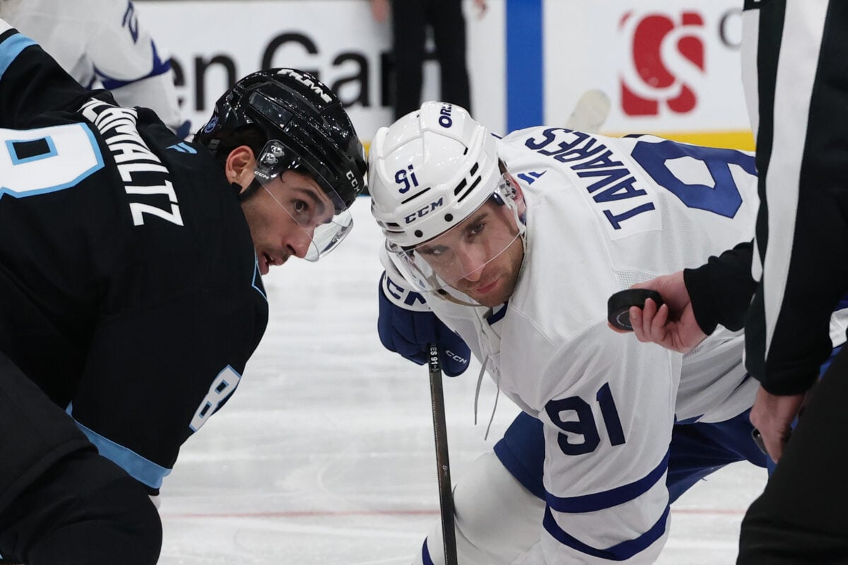 Jan 13, 2026; Salt Lake City, Utah, USA; Utah Mammoth center Nick Schmaltz (8) and Toronto Maple Leafs center John Tavares (91) wait for a faceoff during the third period at Delta Center. Mandatory Credit: Rob Gray-Imagn Images