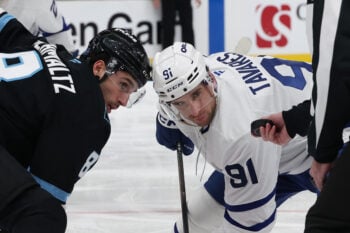 Jan 13, 2026; Salt Lake City, Utah, USA; Utah Mammoth center Nick Schmaltz (8) and Toronto Maple Leafs center John Tavares (91) wait for a faceoff during the third period at Delta Center. Mandatory Credit: Rob Gray-Imagn Images