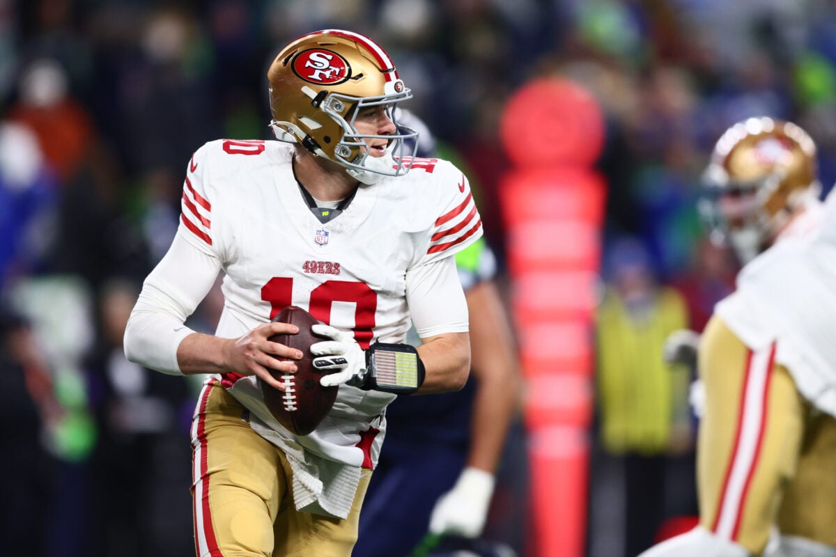 Jan 17, 2026; Seattle, WA, USA; San Francisco 49ers quarterback Mac Jones (10) rolls out against the Seattle Seahawks during the second half in an NFC Divisional Round game at Lumen Field. Mandatory Credit: Kevin Ng-Imagn Images