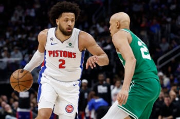 Jan 19, 2026; Detroit, Michigan, USA;  Detroit Pistons guard Cade Cunningham (2) dribbles against Boston Celtics guard Jordan Walsh (27) in the second half at Little Caesars Arena. Mandatory Credit: Rick Osentoski-Imagn Images