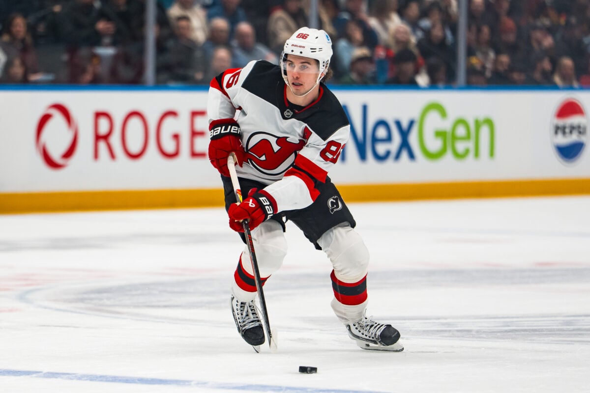 Jan 23, 2026; Vancouver, British Columbia, CAN; New Jersey Devils forward Jack Hughes (86) handles the puck against the Vancouver Canucks in the first period at Rogers Arena. Mandatory Credit: Bob Frid-Imagn Images