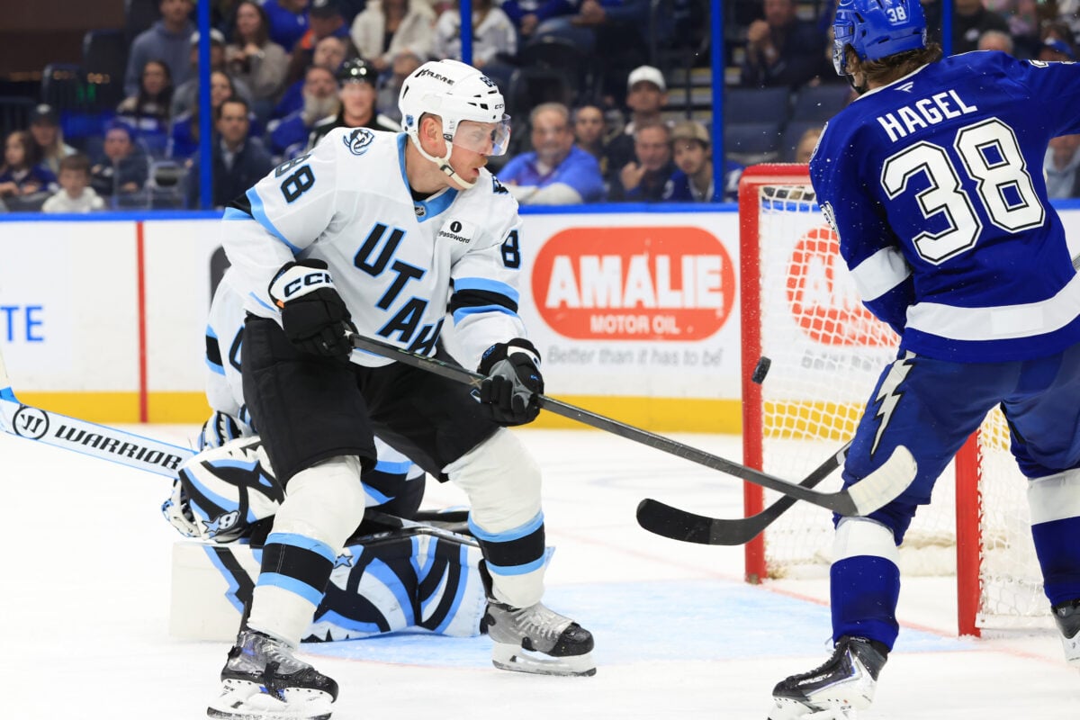 Jan 26, 2026; Tampa, Florida, USA; Tampa Bay Lightning left wing Brandon Hagel (38) taps the puck in past Utah Mammoth defenseman Nate Schmidt (88) and goaltender Karel Vejmelka (70) during the third period at Benchmark International Arena. Mandatory Credit: Kim Klement Neitzel-Imagn Images