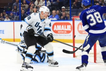 Jan 26, 2026; Tampa, Florida, USA; Tampa Bay Lightning left wing Brandon Hagel (38) taps the puck in past Utah Mammoth defenseman Nate Schmidt (88) and goaltender Karel Vejmelka (70) during the third period at Benchmark International Arena. Mandatory Credit: Kim Klement Neitzel-Imagn Images