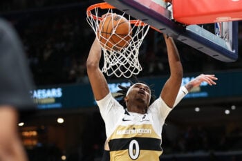 Jan 29, 2026; Washington, District of Columbia, USA; Washington Wizards guard Bilal Coulibaly (0) dunks over Milwaukee Bucks forward Kyle Kuzma (18) during the second half at Capital One Arena. Mandatory Credit: Daniel Kucin Jr.-Imagn Images