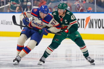 Jan 31, 2026; Edmonton, Alberta, CAN; Edmonton Oilers forward Connor McDavid (97) and Minnesota Wild defensemen Jared Spurgeon (46) battle for position during the third period at Rogers Place. Mandatory Credit: Perry Nelson-Imagn Images