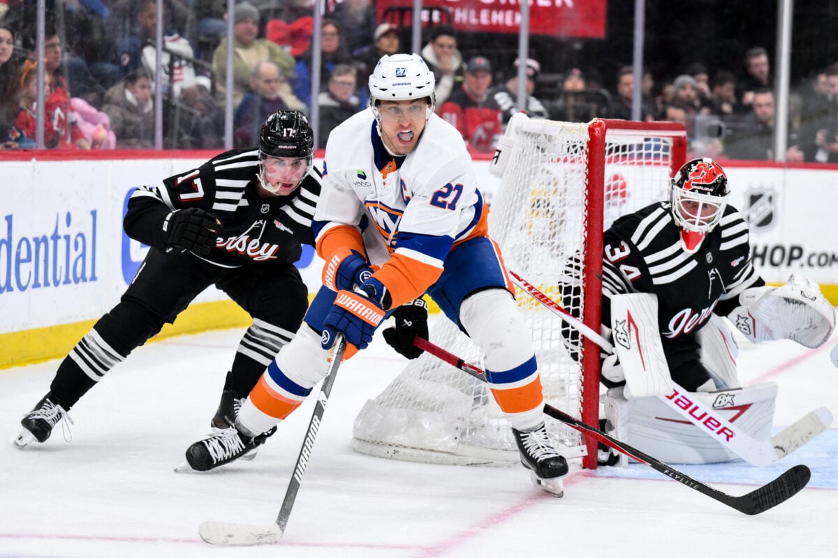 Feb 5, 2026; Newark, New Jersey, USA; New York Islanders left wing Anders Lee (27) skates against New Jersey Devils defenseman Simon Nemec (17) during the third period at Prudential Center. Mandatory Credit: John Jones-Imagn Images