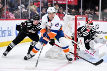Feb 5, 2026; Newark, New Jersey, USA; New York Islanders left wing Anders Lee (27) skates against New Jersey Devils defenseman Simon Nemec (17) during the third period at Prudential Center. Mandatory Credit: John Jones-Imagn Images