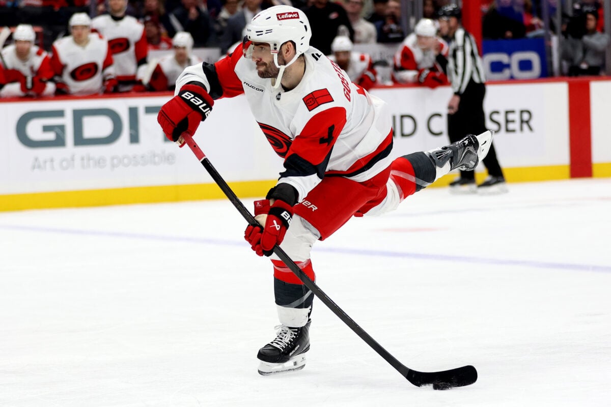 Jan 31, 2026; Washington, District of Columbia, USA; Carolina Hurricanes defenseman Shayne Gostisbehere (4) takes a shot during the second period against the Washington Capitals at Capital One Arena. Mandatory Credit: Daniel Kucin Jr.-Imagn Images