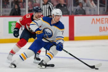 Feb 27, 2026; Sunrise, Florida, USA;  Buffalo Sabres center Ryan McLeod (71) moves the puck against Florida Panthers center Sam Reinhart (13) during the first period at Amerant Bank Arena. Mandatory Credit: Sam Navarro-Imagn Images