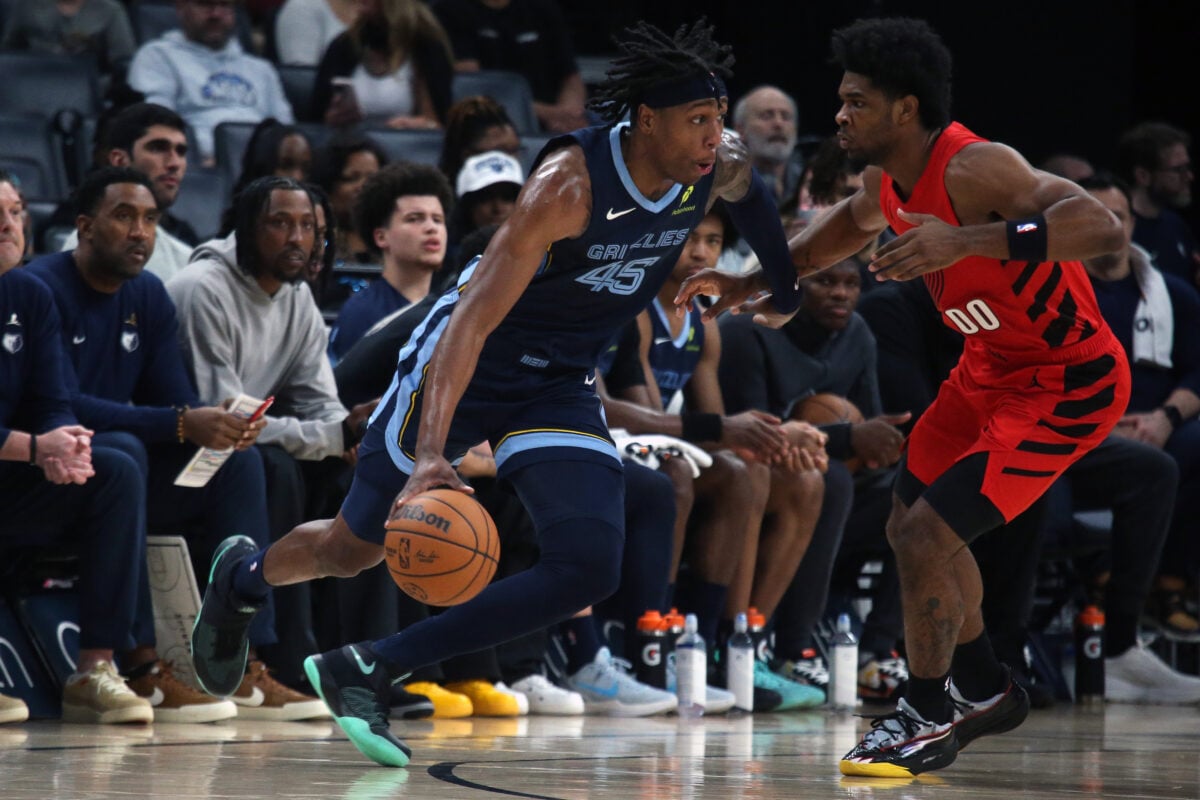 Mar 4, 2026; Memphis, Tennessee, USA; Memphis Grizzlies forward GG Jackson (45) dribbles as Portland Trail Blazers guard Scoot Henderson (00) defends during the second quarter at FedExForum. Mandatory Credit: Petre Thomas-Imagn Images