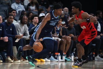 Mar 4, 2026; Memphis, Tennessee, USA; Memphis Grizzlies forward GG Jackson (45) dribbles as Portland Trail Blazers guard Scoot Henderson (00) defends during the second quarter at FedExForum. Mandatory Credit: Petre Thomas-Imagn Images