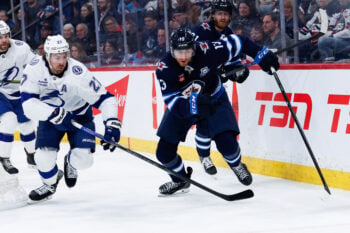 Mar 5, 2026; Winnipeg, Manitoba, CAN;  Tampa Bay Lightning defenseman Ryan McDonagh (27) and Winnipeg Jets forward Gabriel Vilardi (13) skate after the puck during the second period at Canada Life Centre. Mandatory Credit: Terrence Lee-Imagn Images