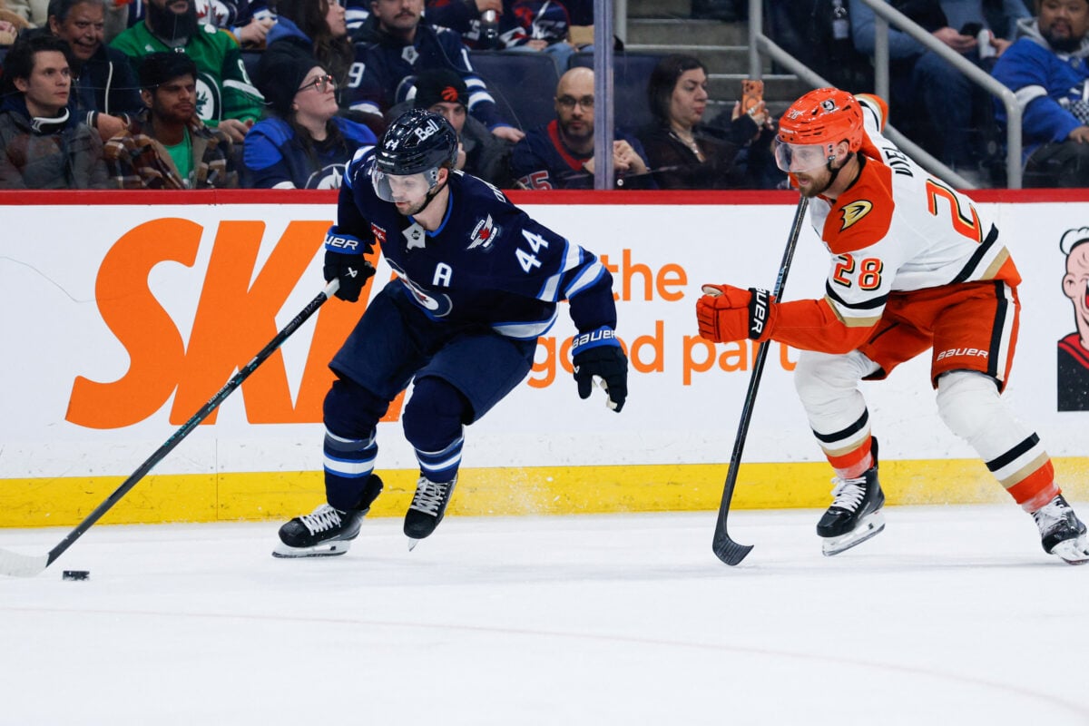 Mar 10, 2026; Winnipeg, Manitoba, CAN; Winnipeg Jets defenseman Josh Morrissey (44) skates away from Anaheim Ducks forward Jeffrey Viel (28) during the third period at Canada Life Centre. Mandatory Credit: Terrence Lee-Imagn Images