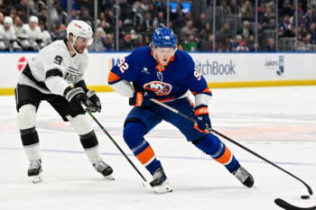Mar 13, 2026; Elmont, New York, USA; New York Islanders right wing Simon Holmstrom (92) makes a move around Los Angeles Kings right wing Adrian Kempe (9) during the second period at UBS Arena. Mandatory Credit: Dennis Schneidler-Imagn Images