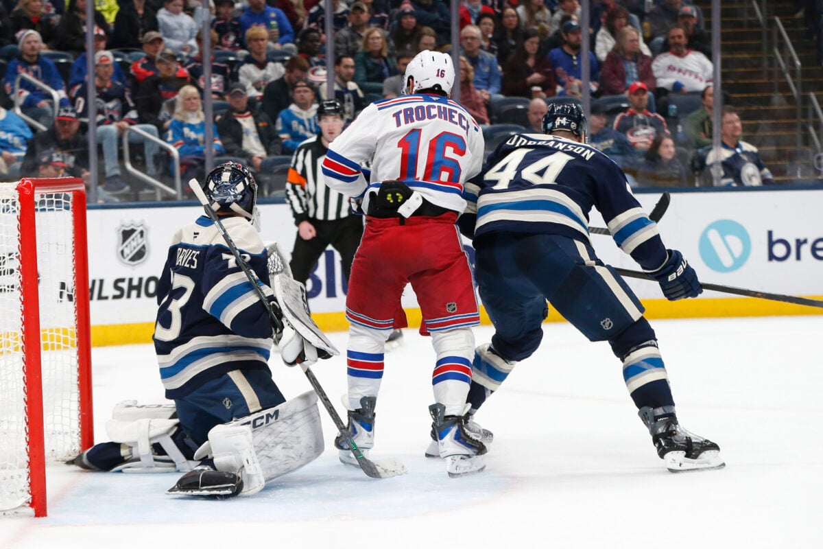 Mar 19, 2026; Columbus, Ohio, USA; Columbus Blue Jackets goalie Jet Greaves (73) makes a save as New York Rangers center Vincent Trocheck (16) looks for a rebound during the third period at Nationwide Arena. Mandatory Credit: Russell LaBounty-Imagn Images