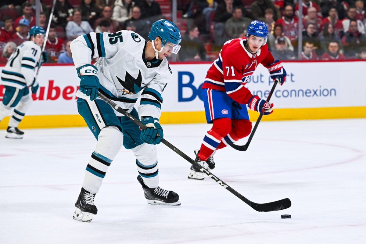 Mar 14, 2026; Montreal, Quebec, CAN; San Jose Sharks defenseman Shakir Mukhamadullin (85) plays the puck against Montreal Canadiens center Jake Evans (71) during the second period at Bell Centre. Mandatory Credit: David Kirouac-Imagn Images