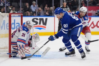 Mar 25, 2026; Toronto, Ontario, CAN; Toronto Maple Leafs forward Dakota Joshua (81) tries to get control of the puck against New York Rangers goaltender Igor Shesterkin (31) as New York Rangers defenseman Matthew Robertson (29) closes in during the third period at Scotiabank Arena. Mandatory Credit: John E. Sokolowski-Imagn Images