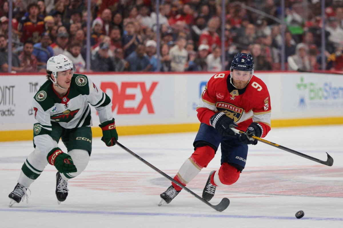 Mar 26, 2026; Sunrise, Florida, USA; Florida Panthers center Sam Bennett (9) moves the puck against Minnesota Wild defenseman Brock Faber (7) during the second period at Amerant Bank Arena. Mandatory Credit: Sam Navarro-Imagn Images