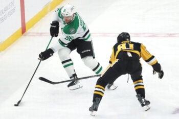 Mar 28, 2026; Pittsburgh, Pennsylvania, USA;   Dallas Stars right wing Mikko Rantanen  (96) moves the puck against Pittsburgh Penguins center Ben Kindel (81) during the third period at PPG Paints Arena. Mandatory Credit: Charles LeClaire-Imagn Images