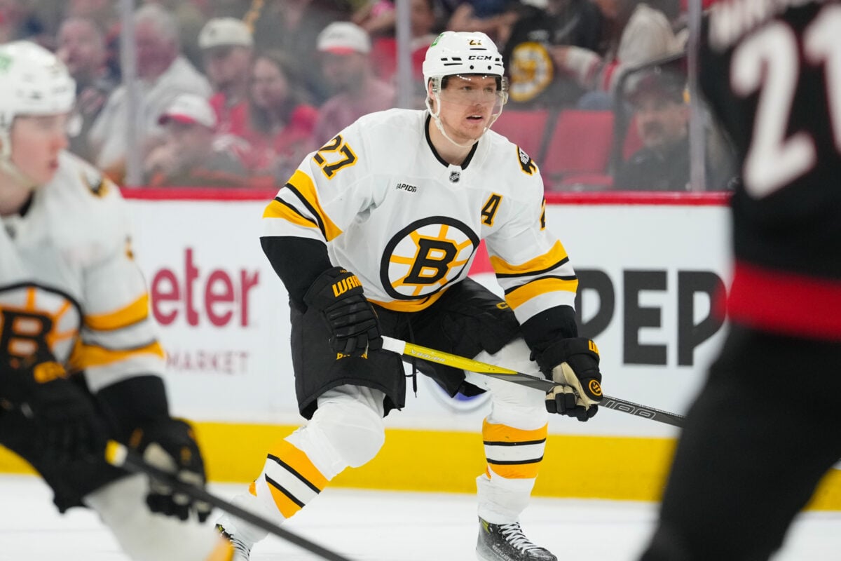 Apr 7, 2026; Raleigh, North Carolina, USA; Boston Bruins defenseman Hampus Lindholm (27) watches the play against the Carolina Hurricanes during the second period at Lenovo Center. Mandatory Credit: James Guillory-Imagn Images