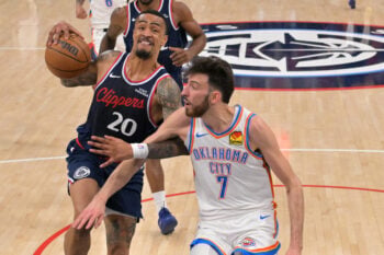 Apr 8, 2026; Inglewood, California, USA;  Los Angeles Clippers forward John Collins (20) is defended by Oklahoma City Thunder center Chet Holmgren (7) as he drives to the basket in the first half at Intuit Dome. Mandatory Credit: Jayne Kamin-Oncea-Imagn Images