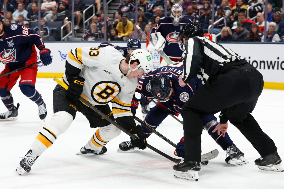 Apr 12, 2026; Columbus, Ohio, USA; Boston Bruins center Fraser Minten (93) and Columbus Blue Jackets center Adam Fantilli (19) face-off during the second period at Nationwide Arena. Mandatory Credit: Russell LaBounty-Imagn Images