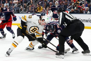 Apr 12, 2026; Columbus, Ohio, USA; Boston Bruins center Fraser Minten (93) and Columbus Blue Jackets center Adam Fantilli (19) face-off during the second period at Nationwide Arena. Mandatory Credit: Russell LaBounty-Imagn Images