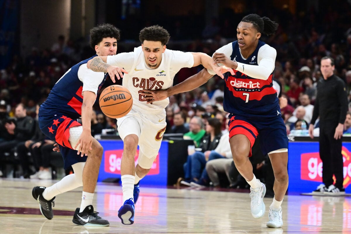 Apr 12, 2026; Cleveland, Ohio, USA; Cleveland Cavaliers guard Tyrese Proctor (24) goes for a loose ball against Washington Wizards guard Bub Carrington (7) during the second half at Rocket Arena. Mandatory Credit: Ken Blaze-Imagn Images