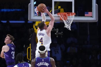 Apr 12, 2026; Los Angeles, California; Los Angeles Lakers forward Dalton Knecht (4) dunks the ball against Utah Jazz guard Hayden Gray (33_, forward Cody Williams (5) and center Oscar Tshiebwe (34) in the second half at Crypto.com Arena. Mandatory Credit: Kirby Lee-Imagn Images