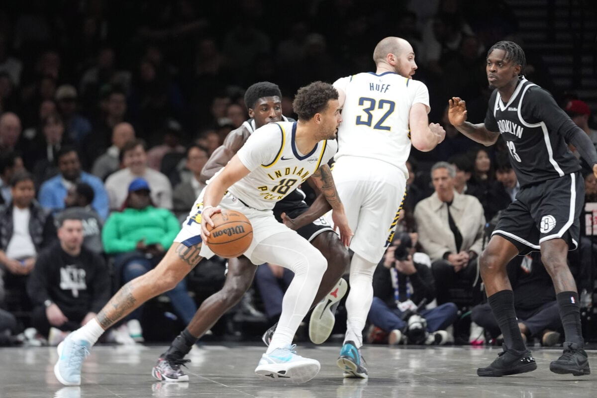 Apr 9, 2026; Brooklyn, New York, USA; Indiana Pacers forward Jalen Slawson (18) dribbles the ball against Brooklyn Nets guard Drake Powell (4) during the first half at Barclays Center. Mandatory Credit: Gregory Fisher-Imagn Images