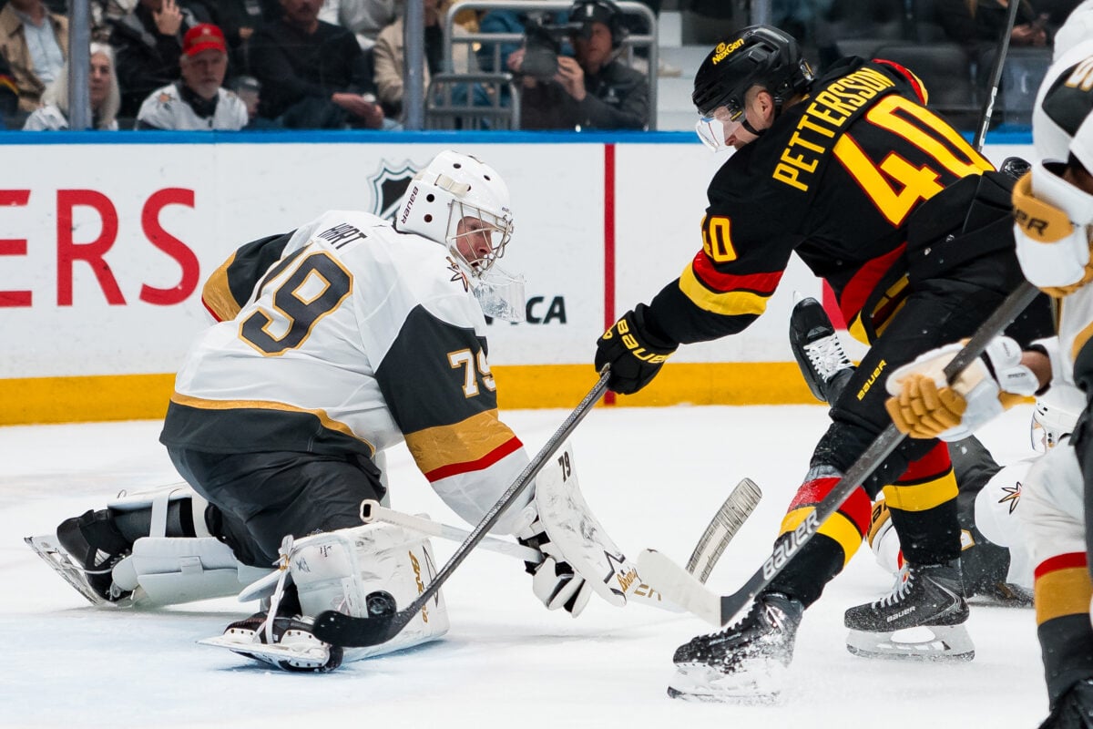 Apr 7, 2026; Vancouver, British Columbia, CAN; Vegas Golden Knights goalie Carter Hart (79) makes a save on Vancouver Canucks forward Elias Pettersson (40) in the second period at Rogers Arena. Mandatory Credit: Bob Frid-Imagn Images