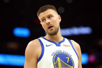 Apr 17, 2026; Phoenix, Arizona, USA; Golden State Warriors center Kristaps Porzingis (7) against the Phoenix Suns during the play-in rounds of the 2026 NBA Playoffs at Mortgage Matchup Center. Mandatory Credit: Mark J. Rebilas-Imagn Images