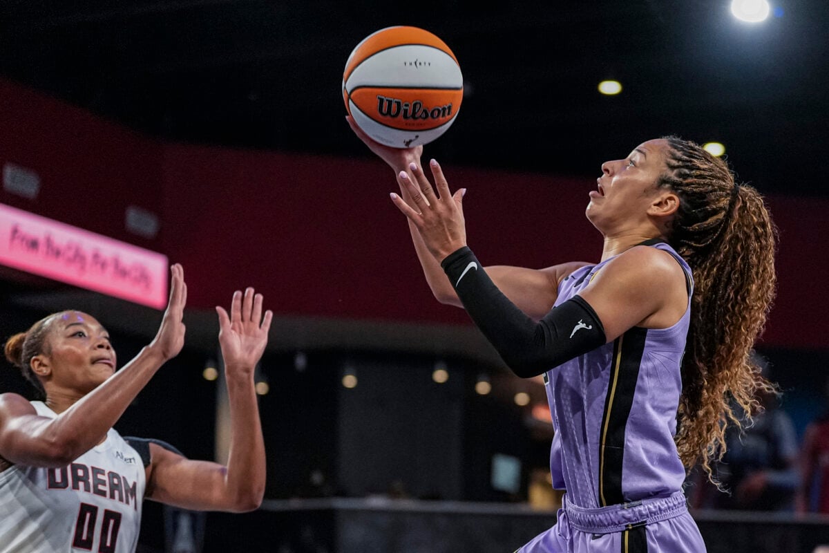 Jul 4, 2026; College Park, Georgia, USA; Golden State Valkyries guard Veronica Burton (22) shoots over Atlanta Dream forward Naz Hillmon (00) during the second half at Gateway Center Arena at College Park. Mandatory Credit: Dale Zanine-Imagn Images