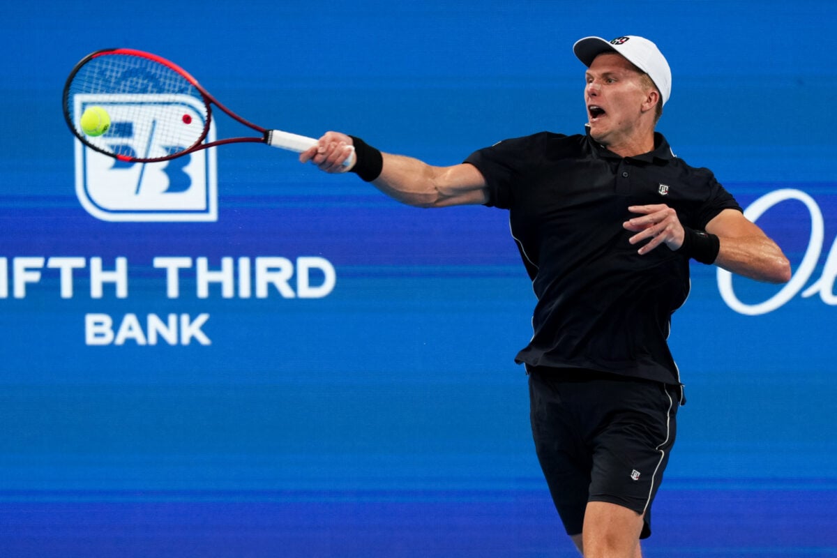 Aug 14, 2026; Mason, OH, USA;  Jenson Brooksby (USA) returns a shot against Jamie Faria (POR) during the Cincinnati Open at Lindner Family Tennis Center. Mandatory Credit: Aaron Doster-Imagn Images